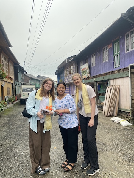 My roommate Mady (right), and I (left) with Pratikshya (middle), the neighbour of our host in Gorkhe village=