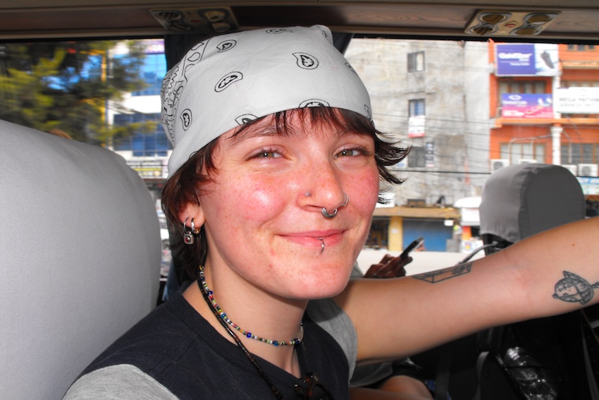 Headshot of El smiling at the camera