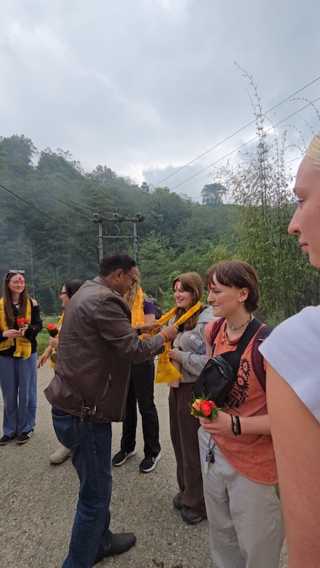 Jorja receiving a blessing from Dham Kumar Pradhan, one of the local community leaders